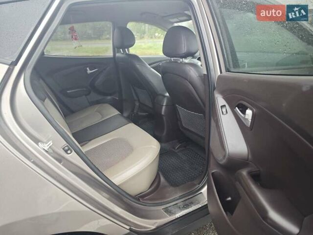 Коричневый Хендай Туксон, объемом двигателя 2.4 л и пробегом 148 тыс. км за 11700 $, фото 23 на Automoto.ua