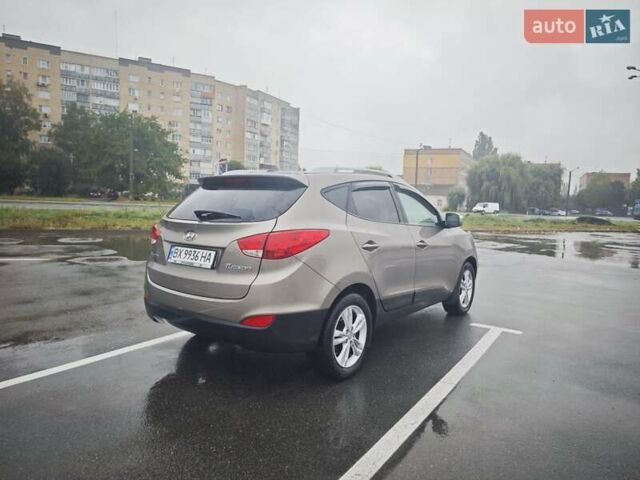 Коричневый Хендай Туксон, объемом двигателя 2.4 л и пробегом 148 тыс. км за 11700 $, фото 9 на Automoto.ua