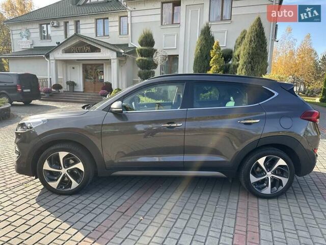 Коричневый Хендай Туксон, объемом двигателя 2 л и пробегом 100 тыс. км за 23500 $, фото 4 на Automoto.ua