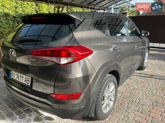 Коричневий Хендай Туксон, об'ємом двигуна 2 л та пробігом 75 тис. км за 19000 $, фото 6 на Automoto.ua
