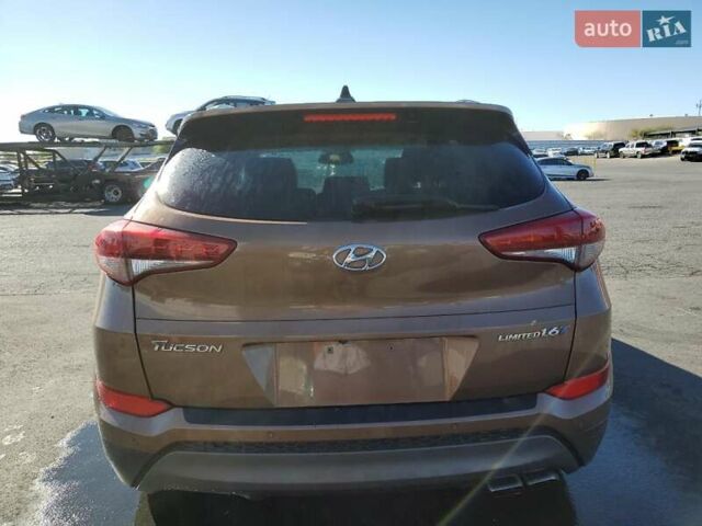 Коричневый Хендай Туксон, объемом двигателя 1.6 л и пробегом 96 тыс. км за 2500 $, фото 5 на Automoto.ua
