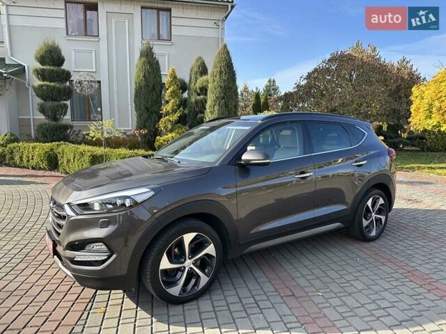 Коричневый Хендай Туксон, объемом двигателя 2 л и пробегом 100 тыс. км за 23500 $, фото 3 на Automoto.ua