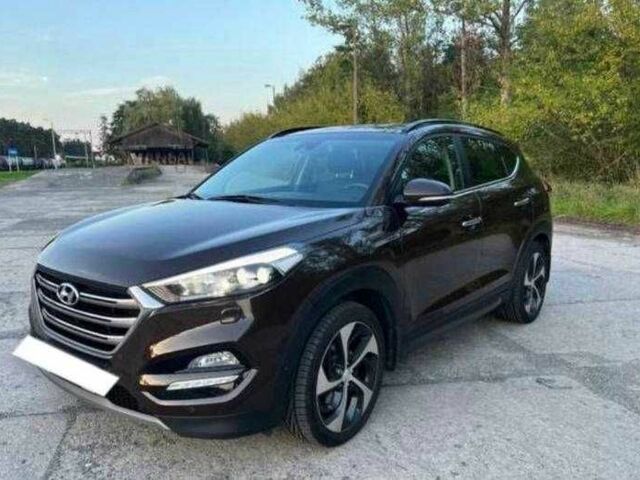 Коричневый Хендай Туксон, объемом двигателя 2 л и пробегом 140 тыс. км за 12100 $, фото 4 на Automoto.ua