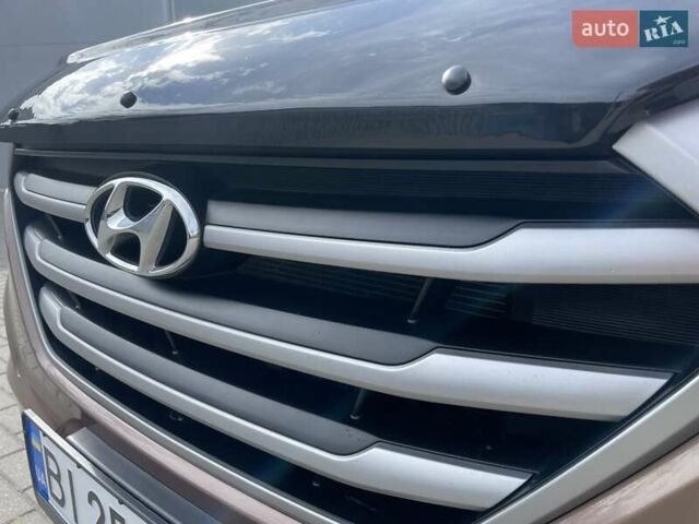 Коричневый Хендай Туксон, объемом двигателя 2 л и пробегом 115 тыс. км за 14200 $, фото 10 на Automoto.ua