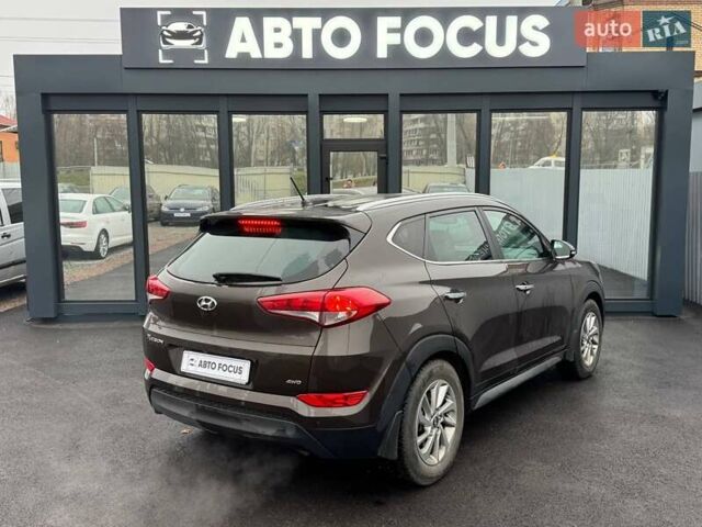 Коричневый Хендай Туксон, объемом двигателя 2 л и пробегом 115 тыс. км за 20990 $, фото 4 на Automoto.ua