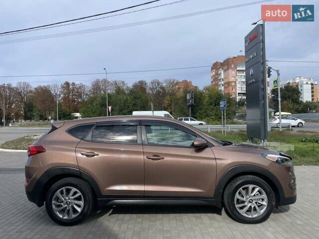 Коричневый Хендай Туксон, объемом двигателя 2 л и пробегом 115 тыс. км за 14200 $, фото 8 на Automoto.ua