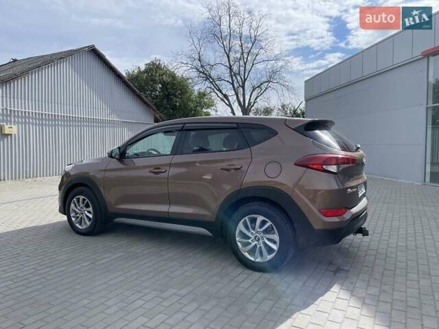Коричневый Хендай Туксон, объемом двигателя 2 л и пробегом 115 тыс. км за 14200 $, фото 4 на Automoto.ua