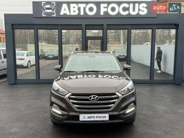 Коричневый Хендай Туксон, объемом двигателя 2 л и пробегом 115 тыс. км за 20990 $, фото 2 на Automoto.ua