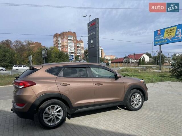 Коричневый Хендай Туксон, объемом двигателя 2 л и пробегом 115 тыс. км за 14200 $, фото 5 на Automoto.ua