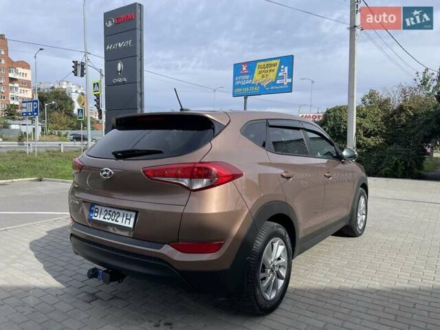 Коричневый Хендай Туксон, объемом двигателя 2 л и пробегом 115 тыс. км за 14200 $, фото 3 на Automoto.ua