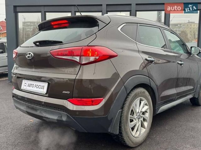 Коричневый Хендай Туксон, объемом двигателя 2 л и пробегом 115 тыс. км за 20990 $, фото 5 на Automoto.ua