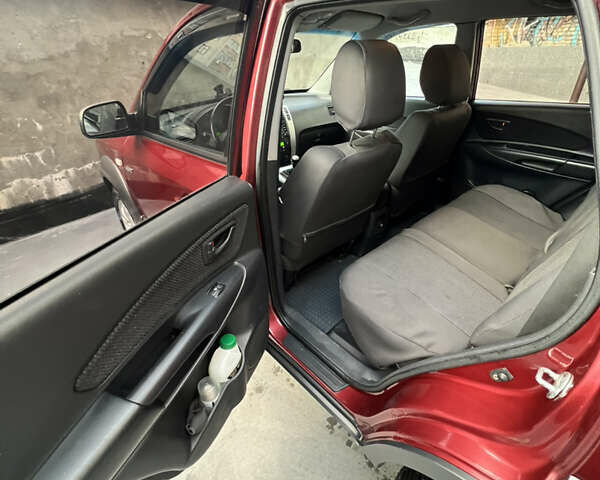 Красный Хендай Туксон, объемом двигателя 1.98 л и пробегом 160 тыс. км за 7900 $, фото 8 на Automoto.ua