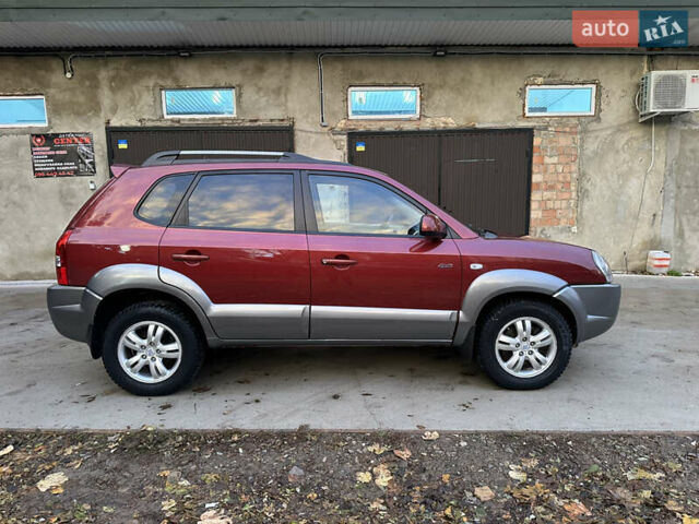 Красный Хендай Туксон, объемом двигателя 1.99 л и пробегом 145 тыс. км за 7999 $, фото 8 на Automoto.ua