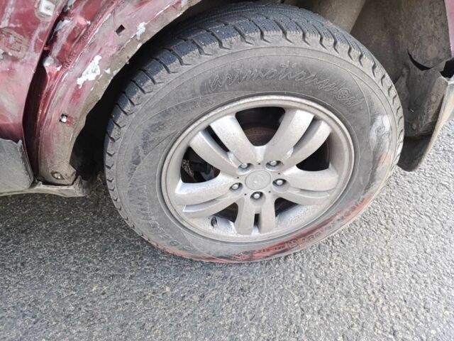 Красный Хендай Туксон, объемом двигателя 2 л и пробегом 170 тыс. км за 4000 $, фото 2 на Automoto.ua