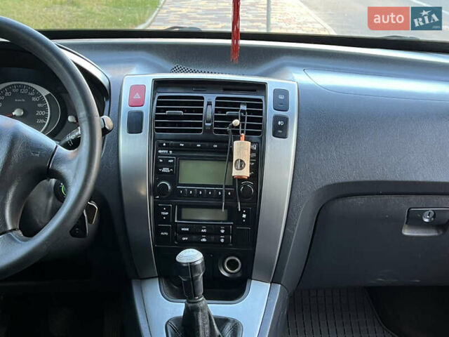 Червоний Хендай Туксон, об'ємом двигуна 2 л та пробігом 228 тис. км за 5999 $, фото 46 на Automoto.ua
