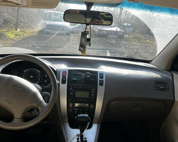 Красный Хендай Туксон, объемом двигателя 1.98 л и пробегом 132 тыс. км за 7850 $, фото 8 на Automoto.ua