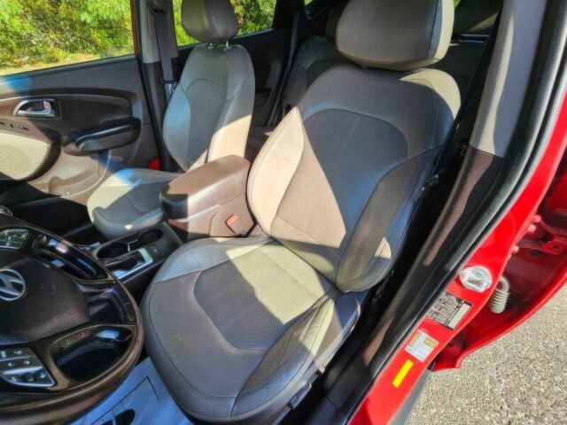 Червоний Хендай Туксон, об'ємом двигуна 2.4 л та пробігом 85 тис. км за 13100 $, фото 7 на Automoto.ua