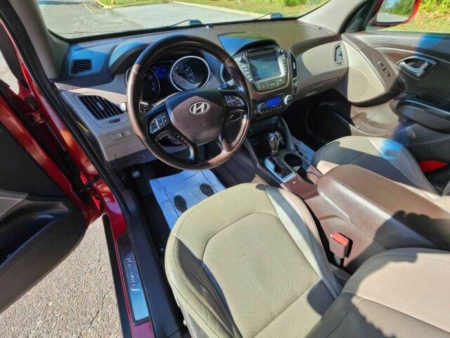 Червоний Хендай Туксон, об'ємом двигуна 2.4 л та пробігом 85 тис. км за 13100 $, фото 8 на Automoto.ua