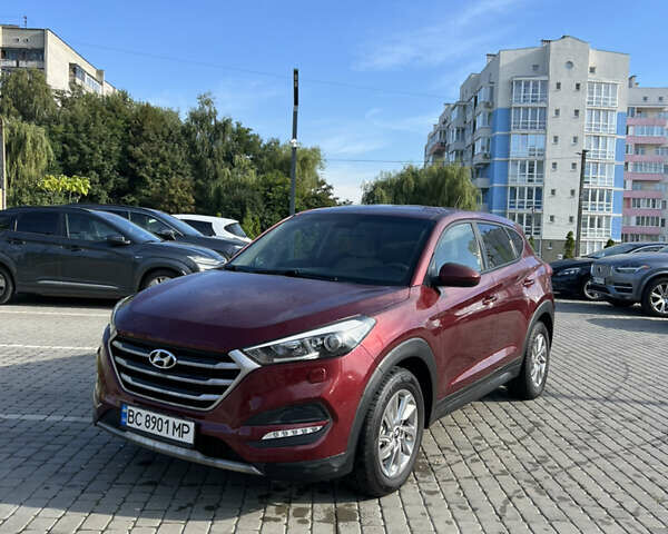 Красный Хендай Туксон, объемом двигателя 2 л и пробегом 133 тыс. км за 14500 $, фото 1 на Automoto.ua