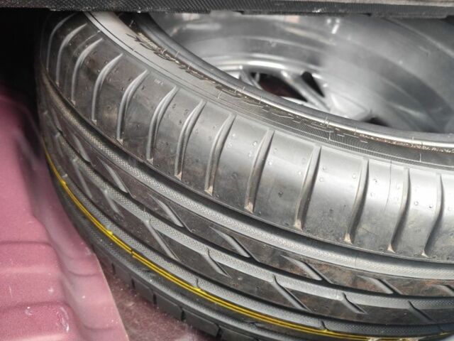 Червоний Хендай Туксон, об'ємом двигуна 2 л та пробігом 110 тис. км за 19800 $, фото 12 на Automoto.ua