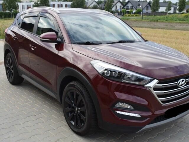 Красный Хендай Туксон, объемом двигателя 2 л и пробегом 34 тыс. км за 10000 $, фото 2 на Automoto.ua
