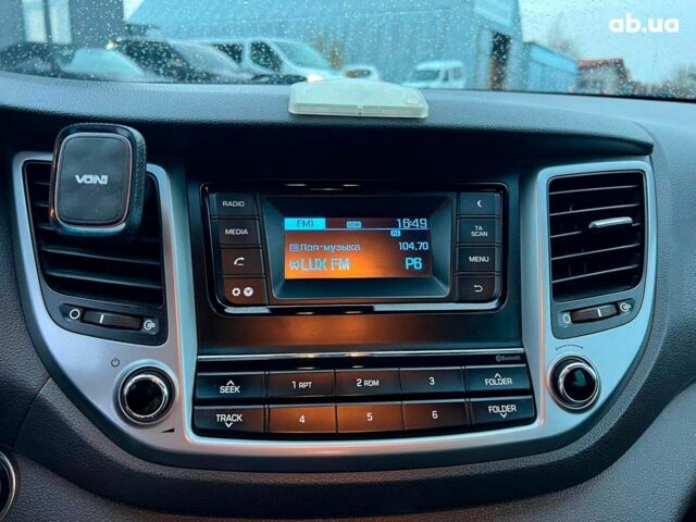 Червоний Хендай Туксон, об'ємом двигуна 2 л та пробігом 136 тис. км за 18690 $, фото 28 на Automoto.ua