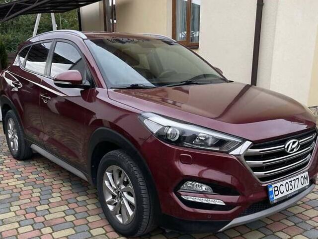 Красный Хендай Туксон, объемом двигателя 2 л и пробегом 160 тыс. км за 17500 $, фото 2 на Automoto.ua