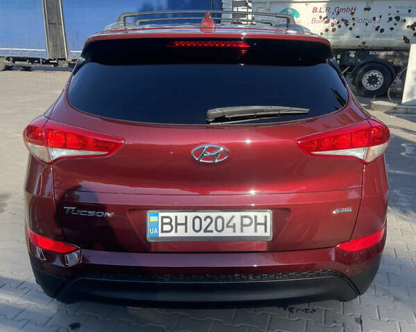 Красный Хендай Туксон, объемом двигателя 2 л и пробегом 102 тыс. км за 16900 $, фото 3 на Automoto.ua