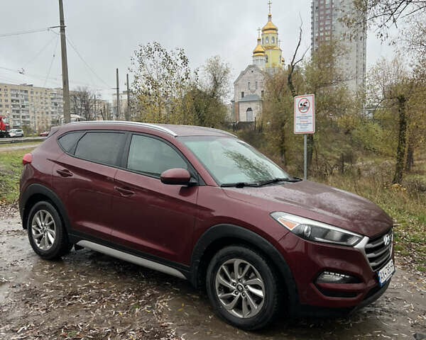 Червоний Хендай Туксон, об'ємом двигуна 2 л та пробігом 150 тис. км за 13300 $, фото 6 на Automoto.ua
