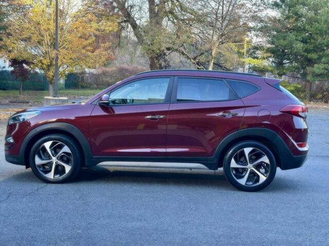 Красный Хендай Туксон, объемом двигателя 1.6 л и пробегом 37 тыс. км за 11550 $, фото 7 на Automoto.ua