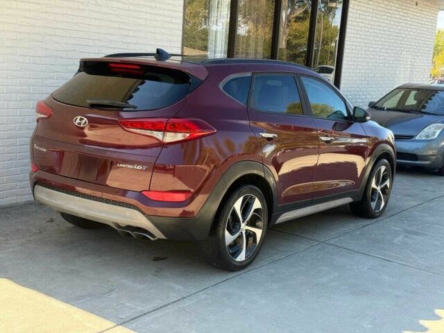 Красный Хендай Туксон, объемом двигателя 1.6 л и пробегом 39 тыс. км за 4800 $, фото 6 на Automoto.ua