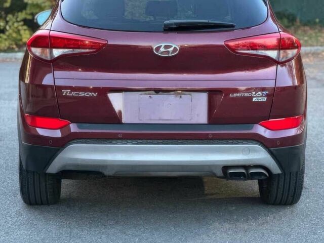 Красный Хендай Туксон, объемом двигателя 1.6 л и пробегом 37 тыс. км за 11550 $, фото 5 на Automoto.ua