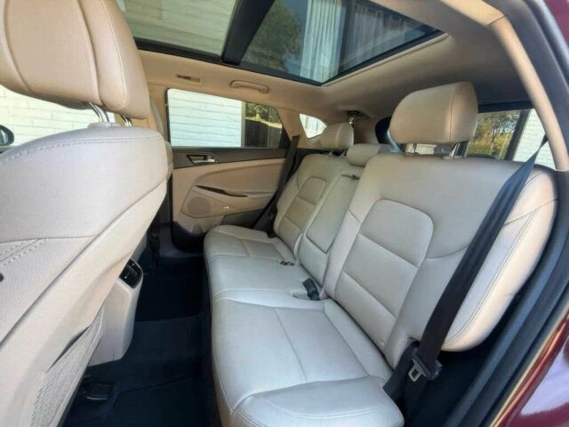 Красный Хендай Туксон, объемом двигателя 1.6 л и пробегом 39 тыс. км за 4800 $, фото 14 на Automoto.ua