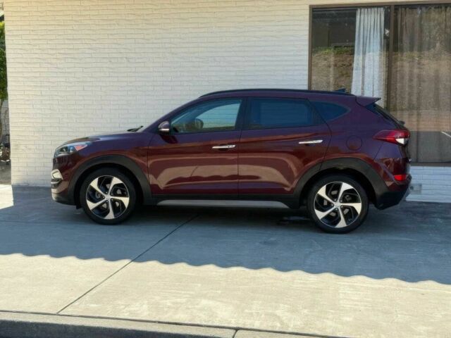 Красный Хендай Туксон, объемом двигателя 1.6 л и пробегом 39 тыс. км за 4800 $, фото 3 на Automoto.ua