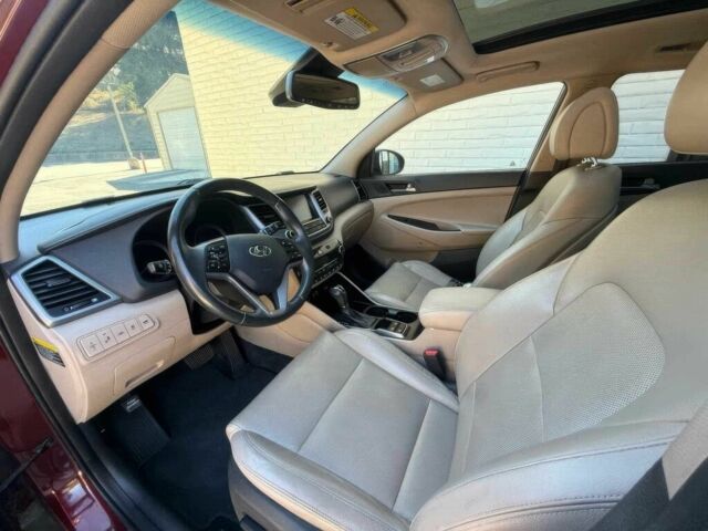 Красный Хендай Туксон, объемом двигателя 1.6 л и пробегом 39 тыс. км за 4800 $, фото 8 на Automoto.ua