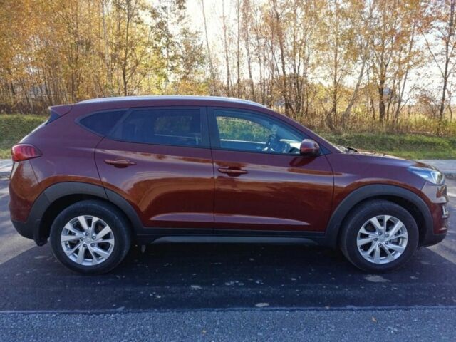 Червоний Хендай Туксон, об'ємом двигуна 2 л та пробігом 74 тис. км за 9600 $, фото 6 на Automoto.ua