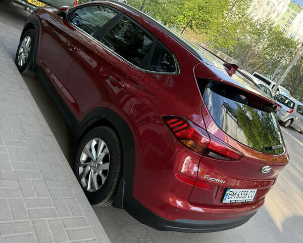 Красный Хендай Туксон, объемом двигателя 2 л и пробегом 75 тыс. км за 22500 $, фото 1 на Automoto.ua
