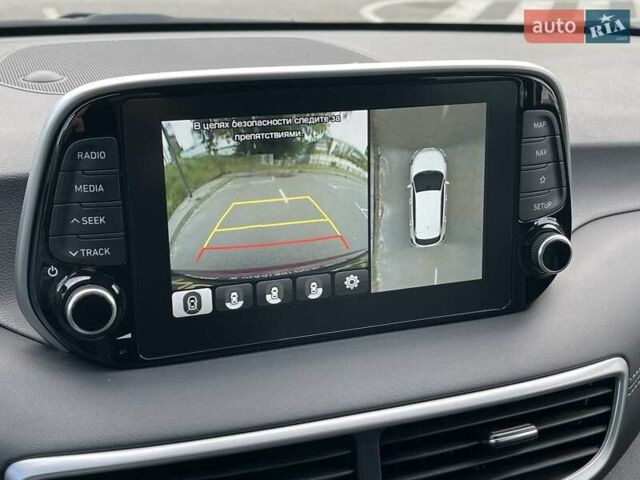 Красный Хендай Туксон, объемом двигателя 2 л и пробегом 64 тыс. км за 30500 $, фото 25 на Automoto.ua