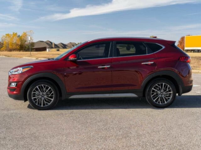 Красный Хендай Туксон, объемом двигателя 2 л и пробегом 45 тыс. км за 14000 $, фото 2 на Automoto.ua