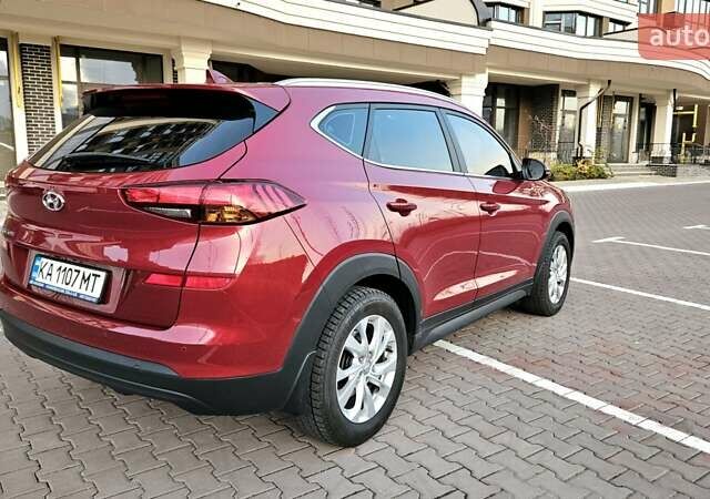 Красный Хендай Туксон, объемом двигателя 2 л и пробегом 94 тыс. км за 19500 $, фото 9 на Automoto.ua