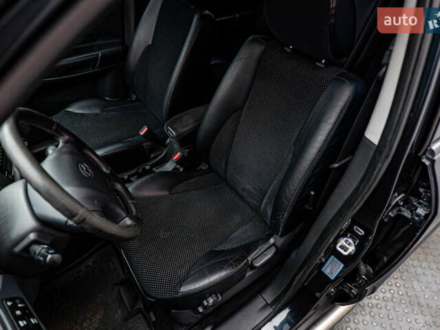 Хендай Туксон, объемом двигателя 2 л и пробегом 209 тыс. км за 9839 $, фото 8 на Automoto.ua
