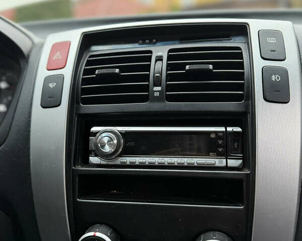 Жовтий Хендай Туксон, об'ємом двигуна 1.98 л та пробігом 192 тис. км за 6800 $, фото 10 на Automoto.ua