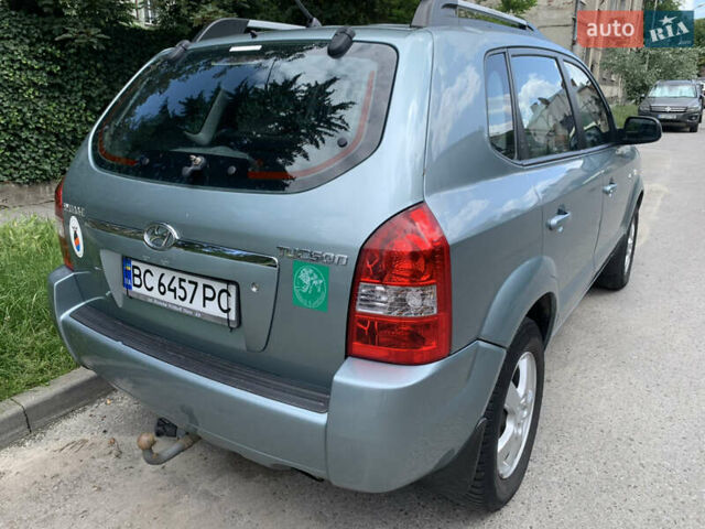 Серый Хендай Туксон, объемом двигателя 1.99 л и пробегом 194 тыс. км за 7850 $, фото 3 на Automoto.ua