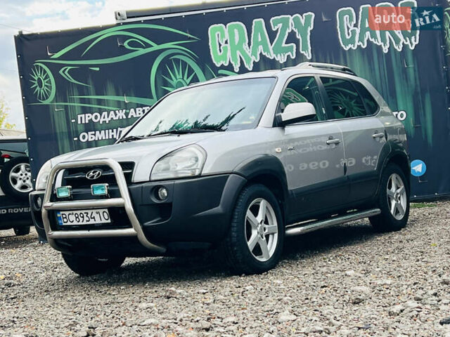 Серый Хендай Туксон, объемом двигателя 1.98 л и пробегом 256 тыс. км за 7500 $, фото 2 на Automoto.ua