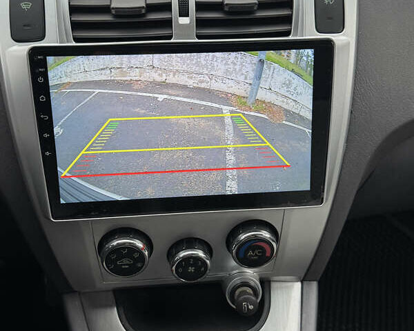 Серый Хендай Туксон, объемом двигателя 2 л и пробегом 163 тыс. км за 8350 $, фото 7 на Automoto.ua