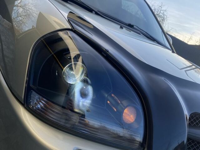 Серый Хендай Туксон, объемом двигателя 2.7 л и пробегом 172 тыс. км за 7500 $, фото 5 на Automoto.ua