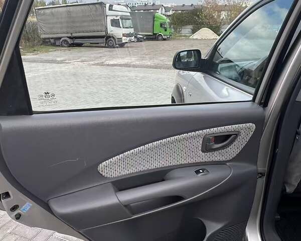 Серый Хендай Туксон, объемом двигателя 1.98 л и пробегом 243 тыс. км за 7100 $, фото 10 на Automoto.ua