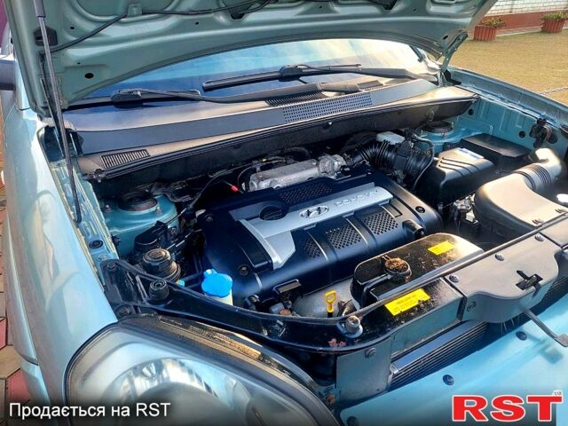 Серый Хендай Туксон, объемом двигателя 2 л и пробегом 175 тыс. км за 6250 $, фото 11 на Automoto.ua