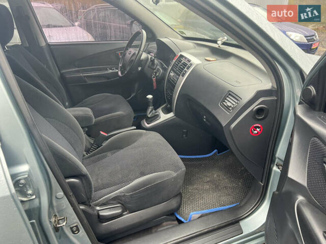 Серый Хендай Туксон, объемом двигателя 1.98 л и пробегом 253 тыс. км за 7650 $, фото 18 на Automoto.ua