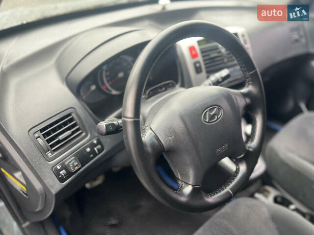 Серый Хендай Туксон, объемом двигателя 1.98 л и пробегом 253 тыс. км за 7650 $, фото 13 на Automoto.ua